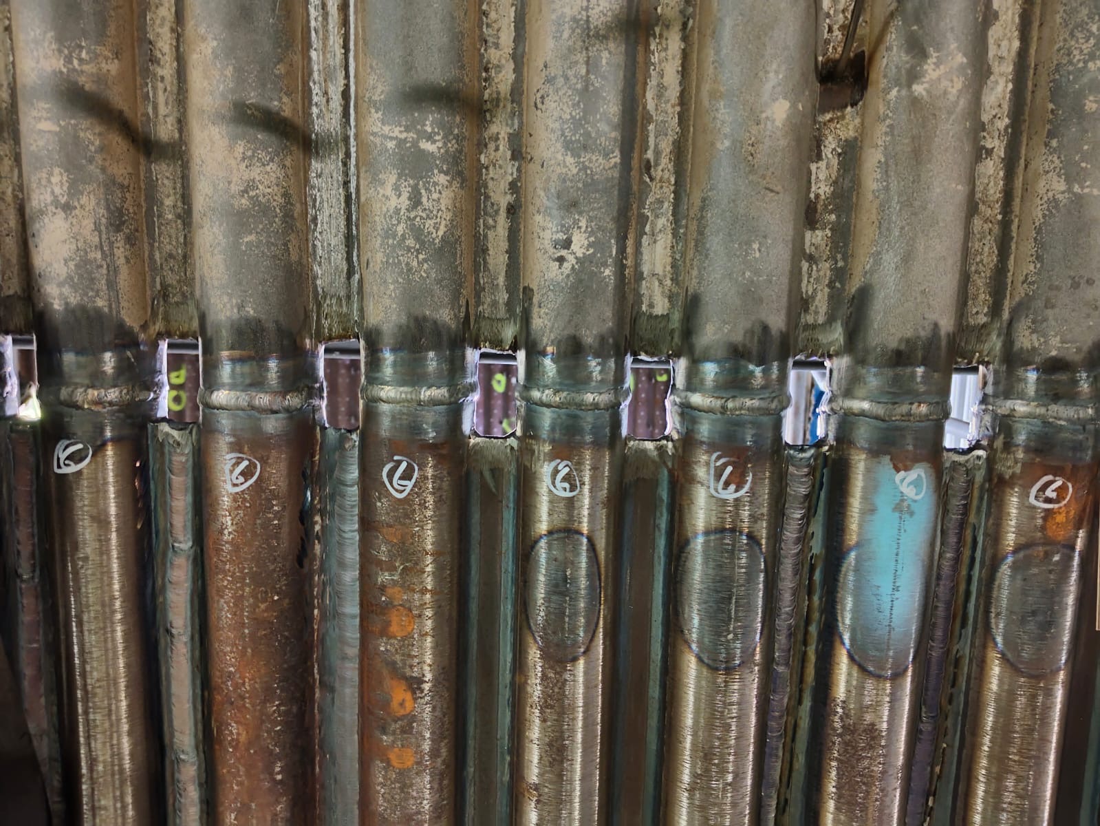 Completed circumferential welds on closely spaced boiler tubes